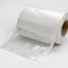 clear-front-white-back-pre-opened-bags-on-a-roll-gallery-detail Close-up detail of clear front and white back pre-opened bags on a roll