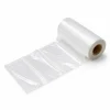 Side-angle view of clear pre-opened bags wound on a roll