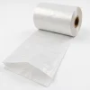 Close-up detail of white opaque pre-opened bags on a roll